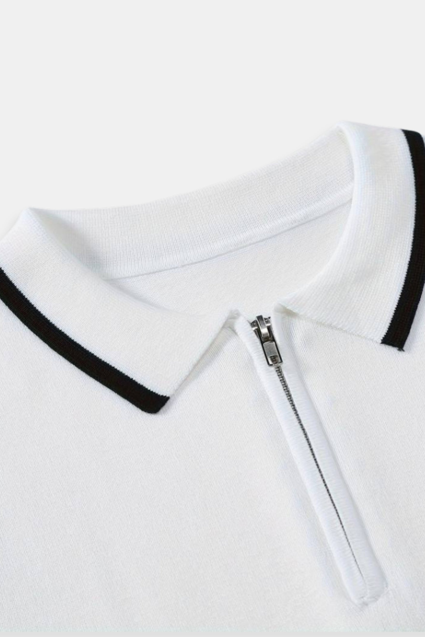 Polo de golf de punto con cremallera de un cuarto de NOBA