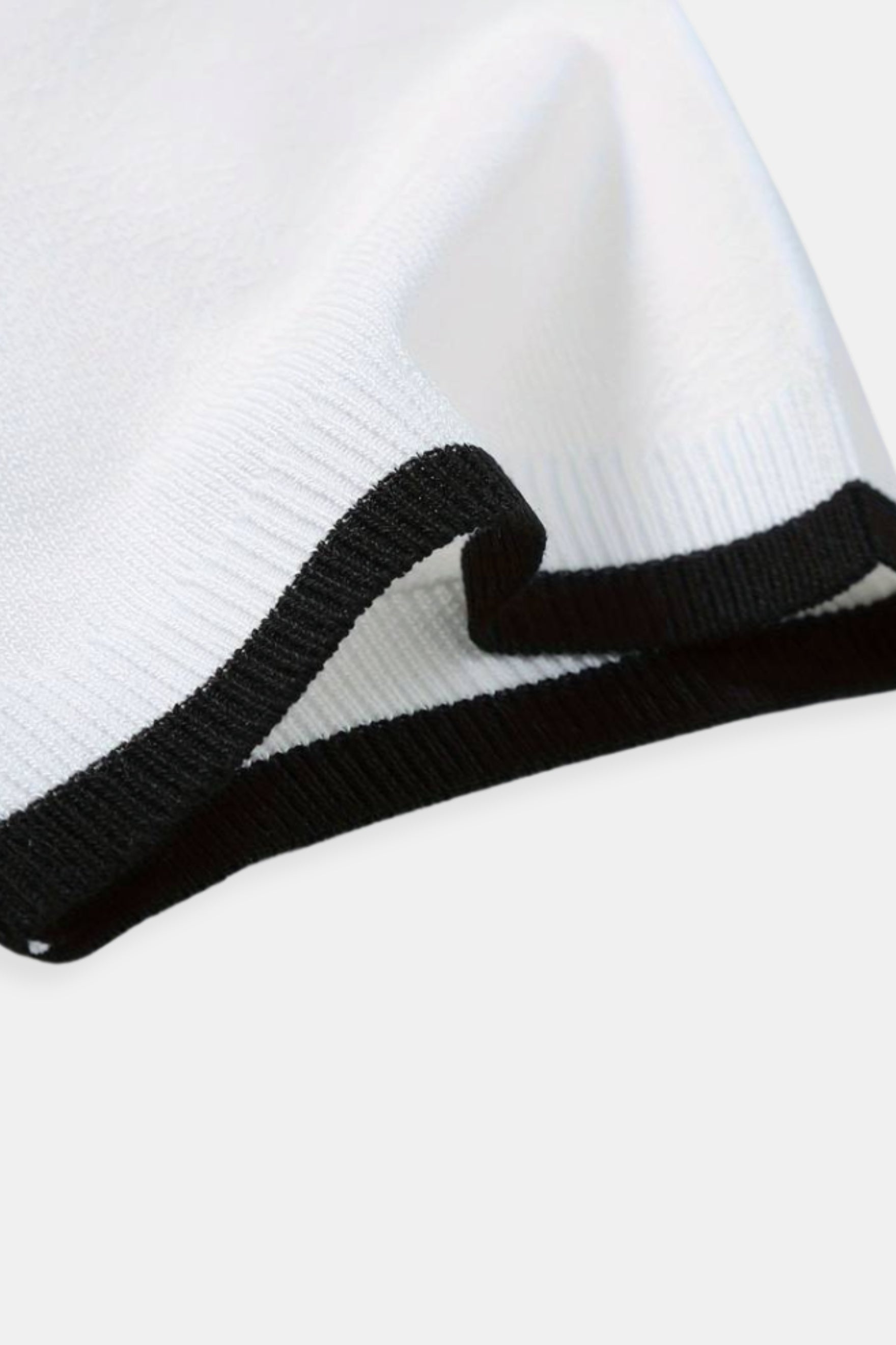 Polo de golf de punto con cremallera de un cuarto de NOBA