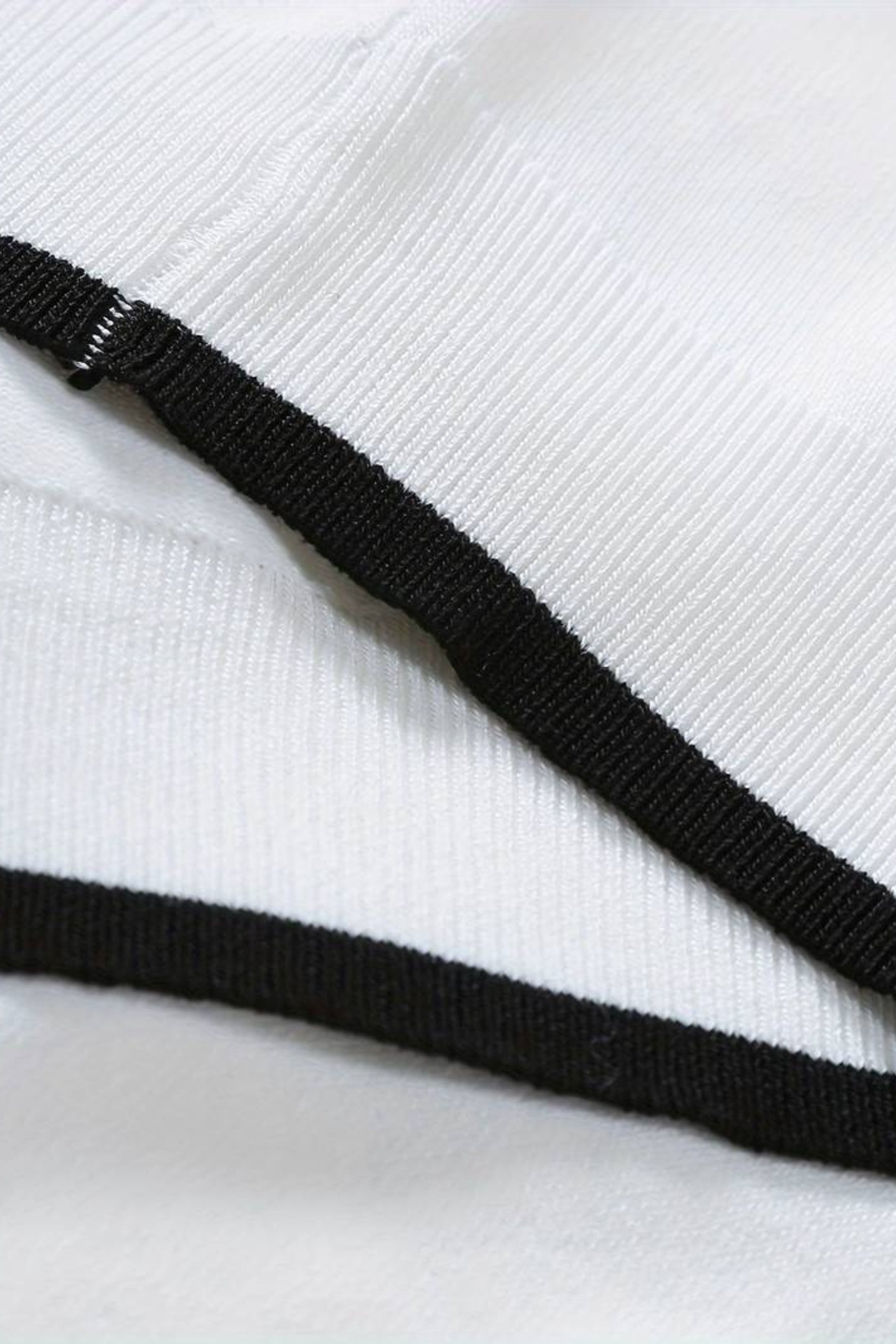 Polo de golf de punto con cremallera de un cuarto de NOBA
