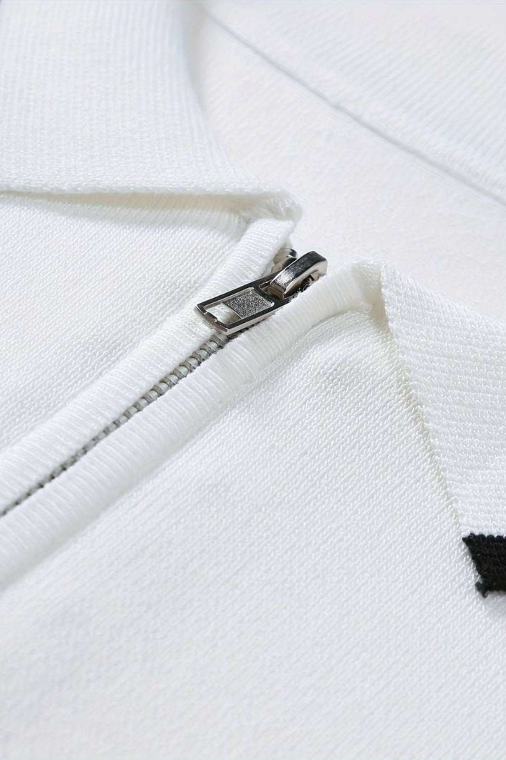 Polo de golf de punto con cremallera de un cuarto de NOBA
