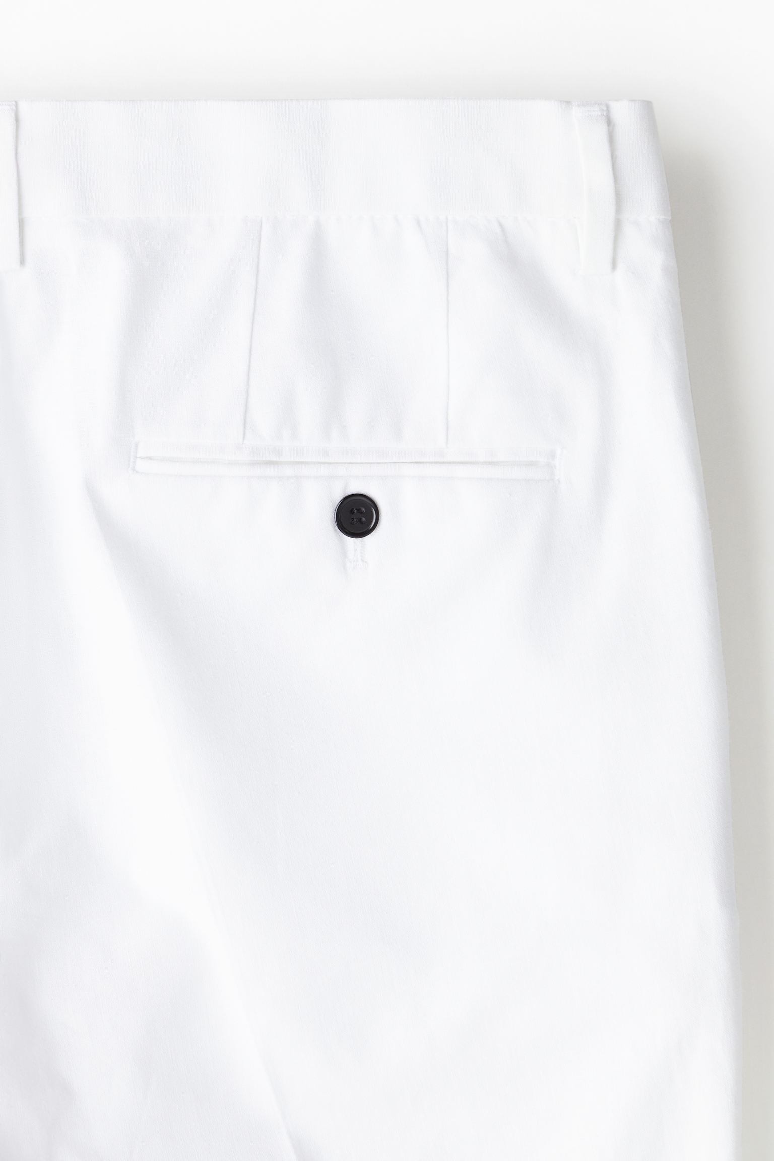 Pantalones chinos elegantes y espaciales ajustados